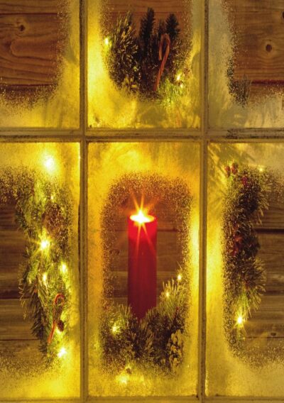 Frosted window with a glowing red candle surrounded by festive greenery and twinkling lights, evoking a cozy Christmas scene