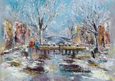 Snow-covered landscape featuring Huband Bridge, with bare trees and colorful buildings along the Grand Canal, evoking winter